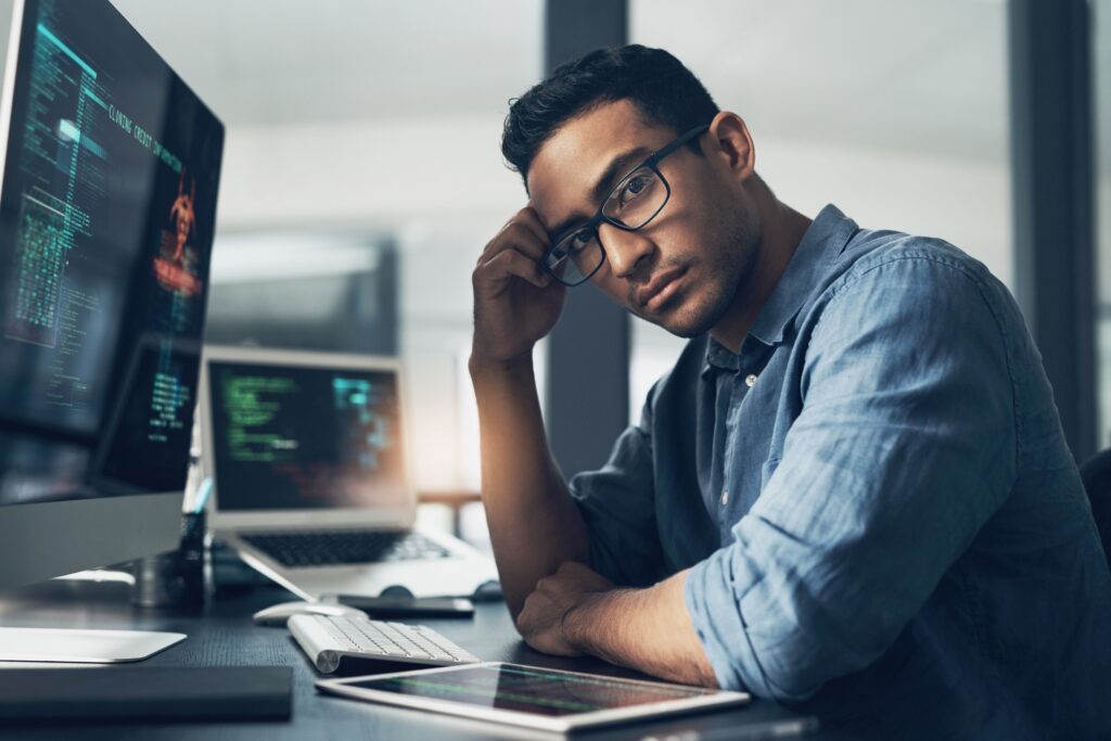 Portrait of a man using a computer in a modern office